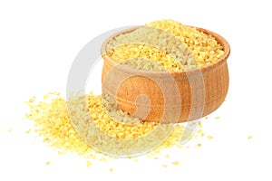 dry bulgur wheat in wooden bowl isolated on white background. top view