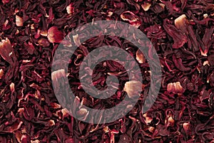 Dry carcade tea, a creative texture background, red flowers of hi photo