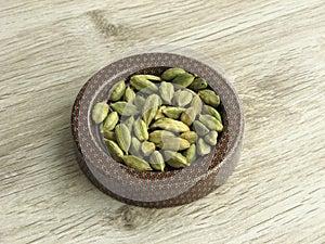 Dry Cardamom Seeds. Light green processed pods of Elettaria cardamomum