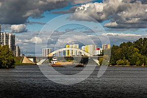 Dry cargo ship on the Moscow Canal river in summer day