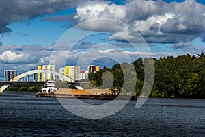 Dry cargo ship on the Moscow Canal river in summer day