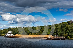 Dry cargo ship on the Moscow Canal river in summer day