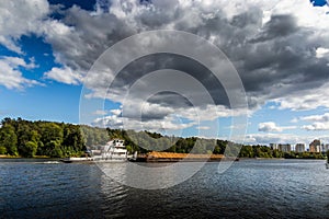 Dry cargo ship on the Moscow Canal river in summer day