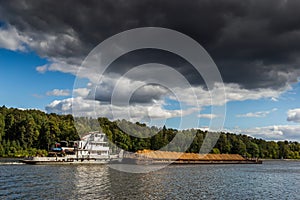 Dry cargo ship on the Moscow Canal river in summer day