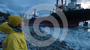 Dry cargo ship ran aground off the coast of the Black Sea. The transport ship is moored at the shore