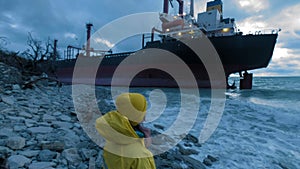 Dry cargo ship ran aground off the coast of the Black Sea. The transport ship is moored at the shore