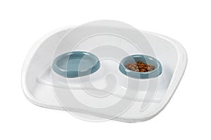 Dry cat food in a bowl isolated on a white background.