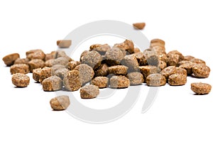Dry cat food isolated on white background close-up top view