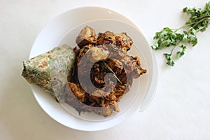 Dry chicken roast with methi paratha, a kind of paratha made of hole wheat flour mixed with Fenugreek leaves