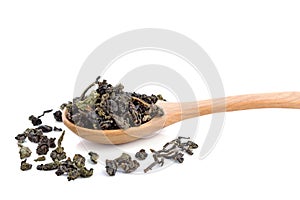 Dry Chinese tea leaves on wooden spoon