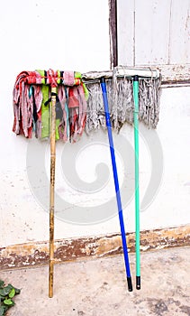 Dry cleaning mob beside the wall. Colorful dry cleaning mob