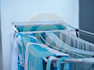 Dry clothes on the dryer in the house after washing. Cleanliness, hygiene.