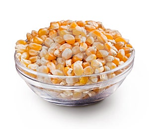 Dry corn in bowl on white background