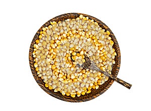 Dry corn grains in bowl for making popcorn