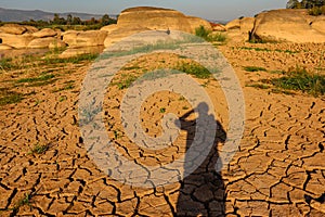 Dry cracked earth background in arid season. Many Province of North East in Thailand the ground dry. Brown cracked soil in the sum