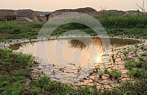 Dry cracked earth background in arid season. Many Province of North East in Thailand the ground dry. Brown cracked soil in the sum