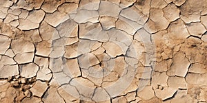 Dry cracked ground, top view of weathered soil pattern, weathered clay texture background. Concept of drought, earth, nature,
