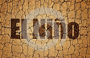 Dry cracked soil with El Nino text. photo