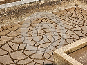 Dry and cracked soil or sediment the treatment pond