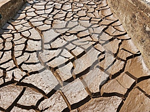 Dry and cracked soil or sediment the treatment pond