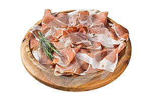 Dry cured parma ham or Prosciutto crudo on a wooden board with rosemary. Isolated on white background. Top view.