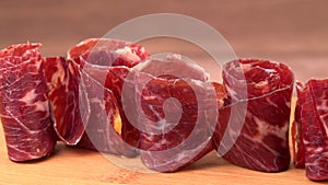 Dry-cured Spanish ham, Serrano ham, Bellota ham, Italian prosciutto crudo or Parma ham, wagyu slice