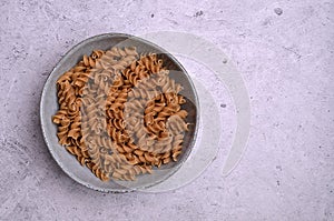 Dry dark brown pasta