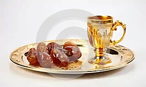 Dry Dates fruit on arabic gold plate and Traditional arabic coffee mug , Generative AI