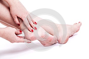 Dry dehydrated skin on the heels of female feet with calluses