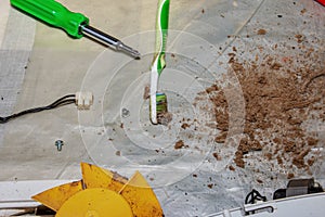 Dry dirt and dust cleaned from a kitchen exhaust fan. Close-up. Air purification concept