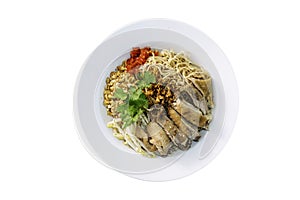 Dry duck noodle in wihte plate on isolated background. Top view