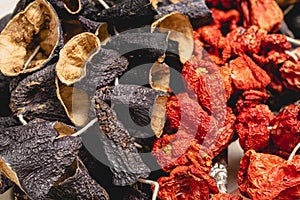 Dry eggplant and dry bell chili hanging in the market, local ingredient, closeup selective focus on blurred background