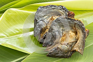 Dry fish on fresh banana leaf