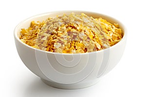 Dry flaked corn in white ceramic bowl.
