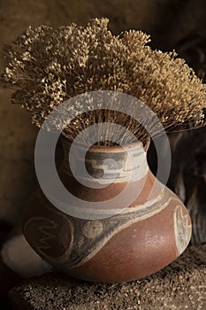 Dry flower arrangment in ancient pottery replica