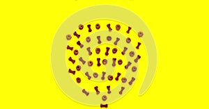 Dry food for animals from figures on yellow background. Creative copy space