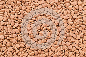 Dry food for cats or doggs - kibble. Organic texture background