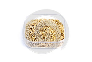 Dry food Daphnia for aquarium fish feed in a transparent box on White background.