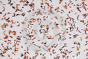 Dry fruit tea randomly scattered on a white table background. Top view. Copy, empty space for text