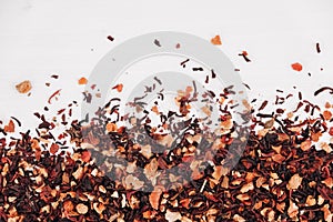 Dry fruit tea randomly scattered on a white table background. Top view. Copy, empty space for text