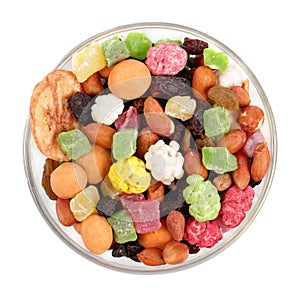 Dry fruits, peanuts and sweets in glass plate