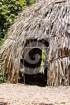 A dry grass hut entrance