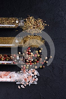 Dry ground spices on dark background