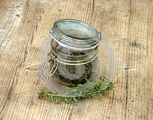 Dry Herbs in Glass Bottle