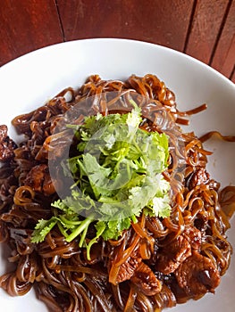 Dry hot noodle food on white dish