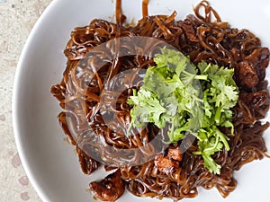 Dry hot noodle food on white dish