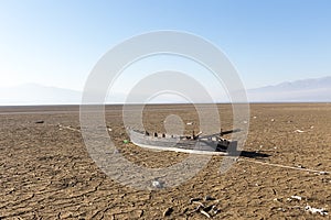 Dry lake bed with natural texture of cracked clay in perspective