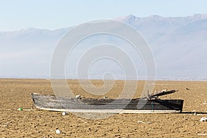 Dry lake bed with natural texture of cracked clay in perspective