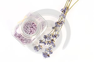 Dry lavender and glass with salt on white background