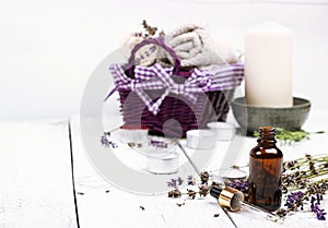 Dry lavender and oil on a white wooden table